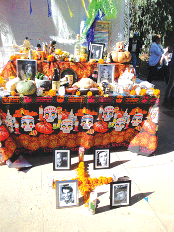 Dia de los Muertos shrine at the Downey event. Many shrines of ancestral alters honoring family and friends were on display. Photo by Tammye McDuff.