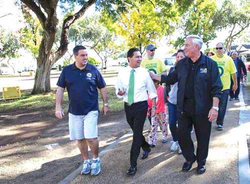 Left to right; Downey Councilman Alex Saab, Mayor Fernando Vasquez, and Councilman Mario Guerra take a stroll along the new trails at Furman Park. The new walking trails at Furman and Apollo Parks were made possible through a grant awarded to the City of Downey by the Los Angeles County Regional Park and Open Space District, as part of the 1996 voter approved Safe Neighborhood Parks Bond Act. Photo by Tammye McDuff.