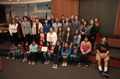 Fedde MS principal, teachers, and staff listen to ABCUSD Superintendent Dr. Mary Sieu talk about Fedde achieving Schools to Watch. Photo by Tammye McDuff.