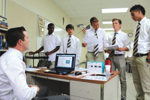 St._John_Bosco_Students_Pitching_Buisness_Ideas_to_Teacher