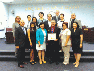 The ABC Board and teachers stand with Hawaiian Gardens Councilmen Victor Farfan and Mike Gomez. The City of Hawaiian Gardens donated 1,000 licenses to elementary schools for the reading program. The program started at Artesia High nine years ago and then Gahr High, and Fedde and Ross Middle Schools began utilizing the program with tremendous results.