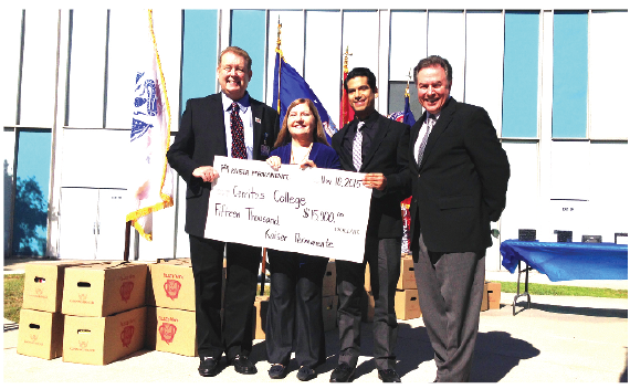 Jim Branchick (l) presenting check to Cerritos College From (l-r) Dr. Renee Chomiak, Christian Hernandez, and Steve Richardson Photo courtesy Kaiser Permanente.