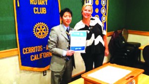 Local Rotary Club Receives Special Honor By Larry Caballero CAPTION: The Rotary Club of Cerritos-Artesia was presented with a special banner at its regular meeting Feb 8 for having all of its members contribute at least $100 to the Rotary Foundation in 2014~2015. President Sug Kitahara accepts the honor from the Assistant Governor Lauren Pittman on behalf of the club. The Rotary Foundation transforms gifts into projects that change lives both close to home and around the world. As the charitable arm of Rotary, it taps into a global network of Rotarians who invest their time, money, and expertise into priorities, such as eradicating polio and promoting peace.  “Foundation grants empower Rotarians to approach challenges such as poverty, illiteracy, and malnutrition with sustainable solutions that leave a lasting impact,” said Kitahara. 
