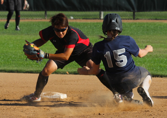 Aya Nogi of the Denso softball team from Japan is ready to tag former Cerritos High and current University of Hawai'i catcher Heather Cameron on a stolen base attempt in the top of the second inning of last Saturday evening's game at Fullerton College. Denso blanked a USA Cal A's select team 2-0 and won all five games played from July 5-10. Photo Armando Vargas.