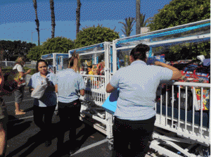 Hundreds of donated toys were taken from a caravan of cars and transported throughout Miller Children’s in giant cribs. 