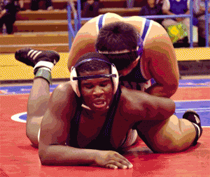 John Glenn High junior Josiah Delgado, wrestling at 220 pounds, has a good hold of Taylen Washington of Mayfair High in the final event of last Thursday's Suburban League wrestling meet. Delgado defeated Washington 9-3 but Mayfair won the meet 52-13, giving Glenn its first league loss of the season. PHOTO BY ARMANDO VARGAS, Contributing photographer 